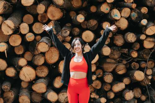 Woman In Workout Clothing Holds Her Hands Above Photo
