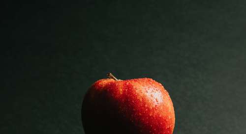 Macro Water Drops On A Red Apple Photo