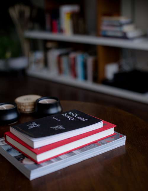 Stack Of Books And Candles On A Lounge Coffee Table Photo