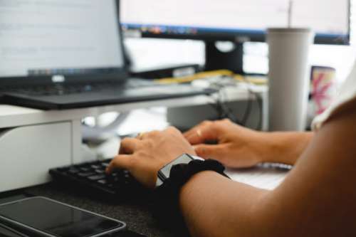 Photo Of A Person Typing With Both Hands On Keyboard Photo