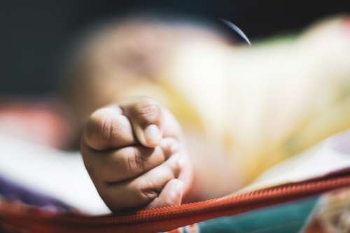 Photo Of A Toddler With Small Clenched Fist Photo