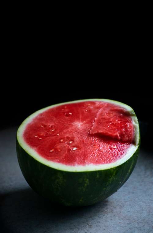 Half Of A Perfect Ripe Watermelon On A Countertop Photo