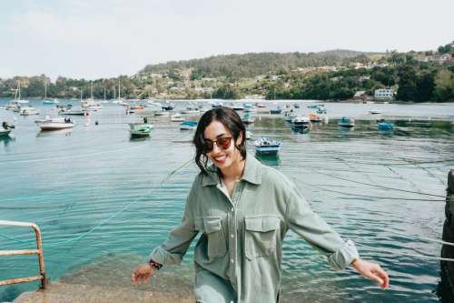 Woman In Sunglasses Walks Towards The Camera Photo