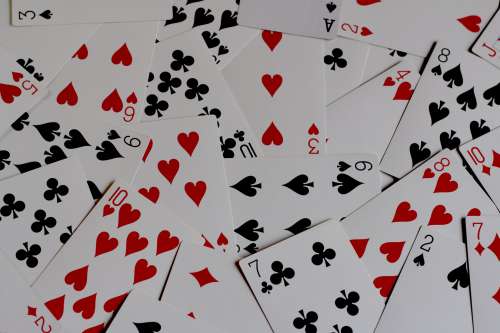 Playing Cards Lay In A Messy Pile Photo