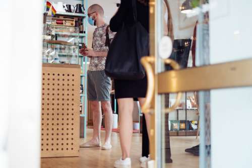 Male customer waiting at the counter in a café 2