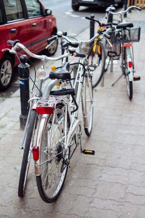Bicycles attached to bike racks