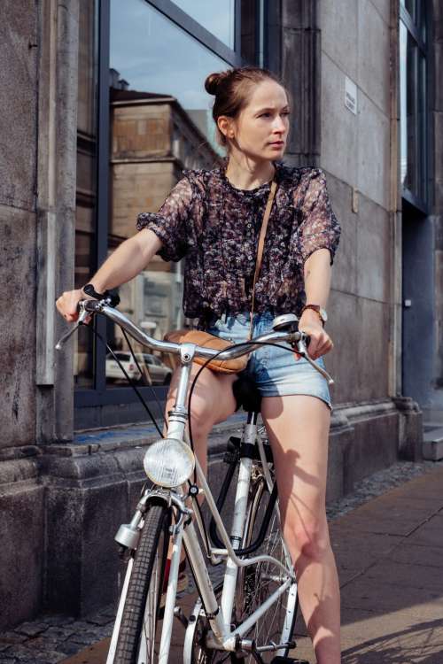 Female on a bicycle in the city 3