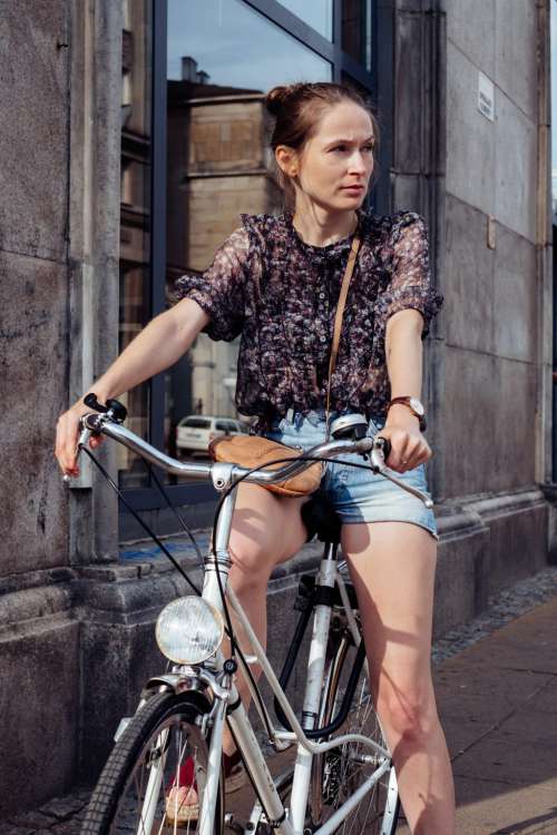 Female on a bicycle in the city 2