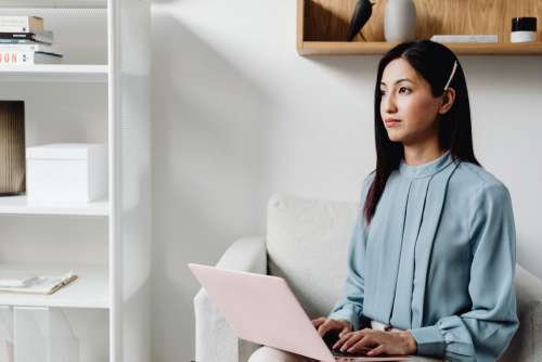 Young Asian Woman At Office