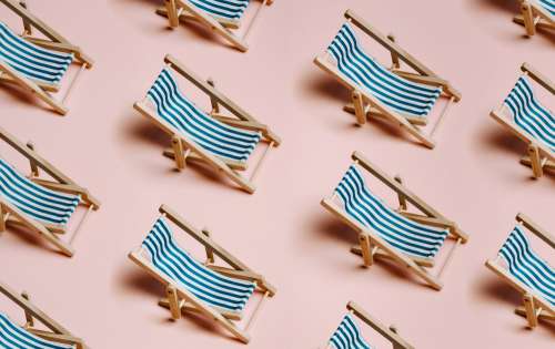 Rows Of Beach Chairs With Blue And White Fabric Photo