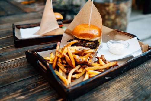 Tray With Fried A Burger And A Glass Ramekin Photo
