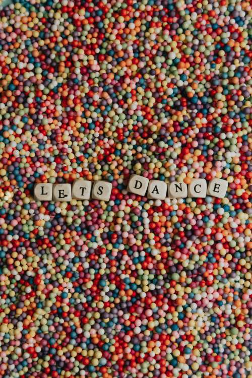 Wooden Blocks With Black Letters Spell Lets Dance Photo