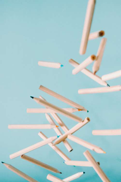 Wooden Coloring Pencils Fly Through The Air Photo