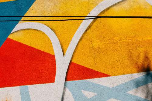 Close Up Of A Painted Cement Wall With Splashes Of Colour Photo
