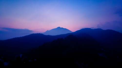 Landscape Of Blue Hills And A Pink Sky At Sunset Photo