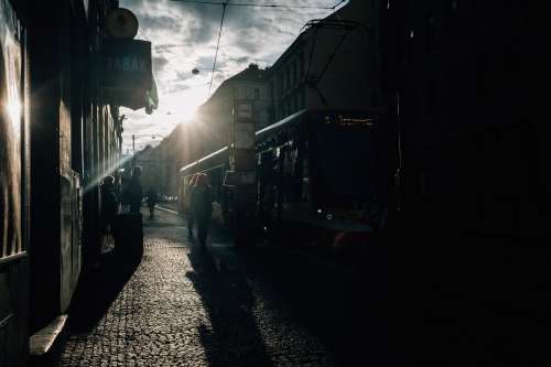 Low Sun Silhouetted People On A City Street Photo