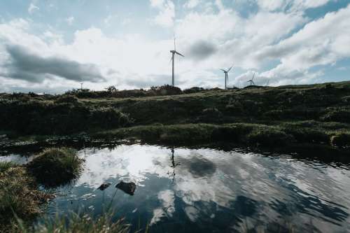 Grassy Hills With Modern Windmills Photo