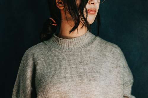 Persons Torso And Neck In A Grey Sweater Photo