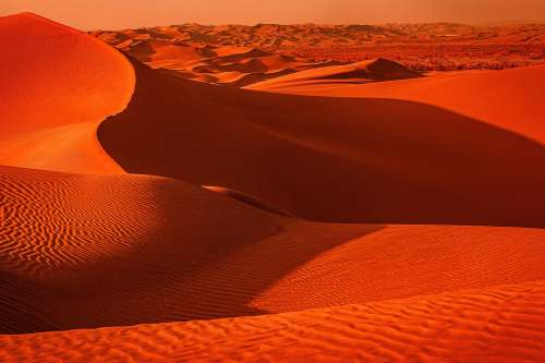 Landscape Of Sandy Wavy Texture In The Desert Photo