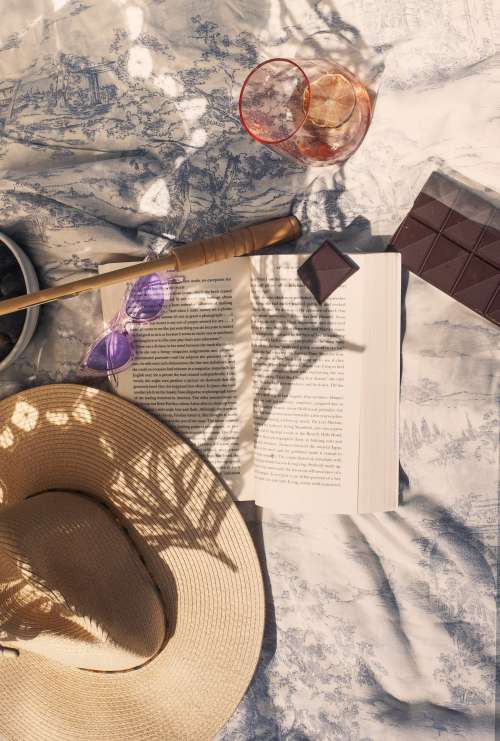 Flatlay Of A Picnic In The Shadow Of A Lace Umbrella Photo