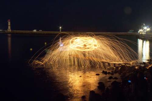 Long Exposure Of Fireworks Exploding At Night Photo