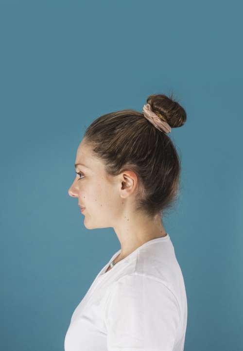 Profile Of A Woman With Her Hair In A Scrunchie Bun Photo