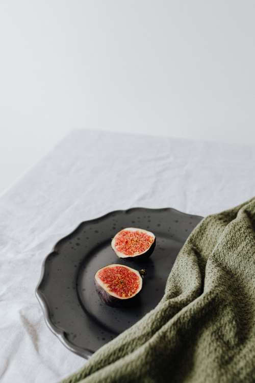Fruits on a black stoneware plate