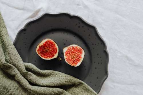 Fruits on a black stoneware plate