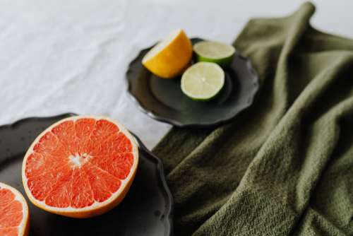 Fruits on a black stoneware plate