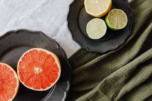 Fruits on a black stoneware plate