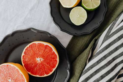 Fruits on a black stoneware plate