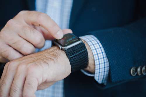 Wrists Of A Person In A Blue Suit With A Smart Watch Photo