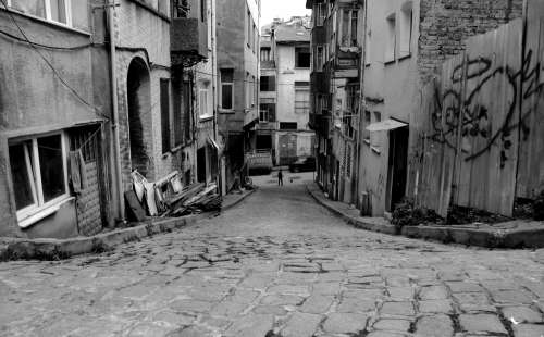 Black And White Photo Of A Narrow City Street Photo