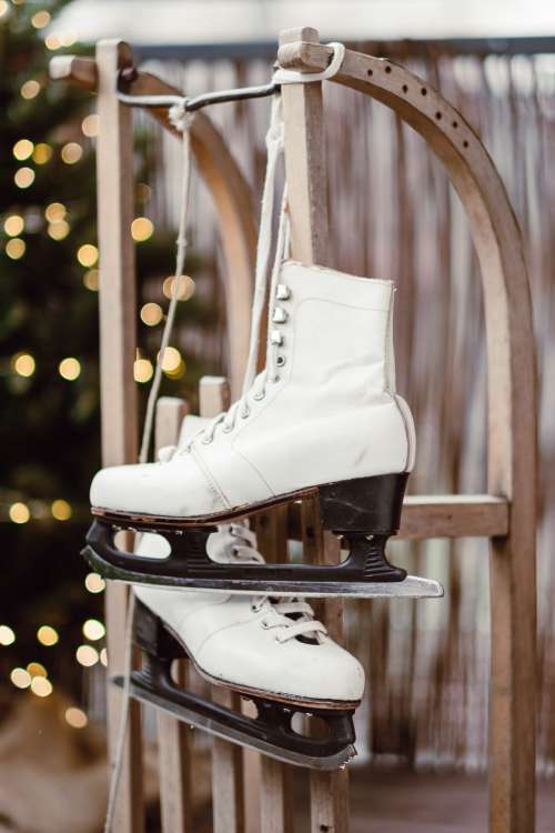 Vintage ice skates on a wooden sled