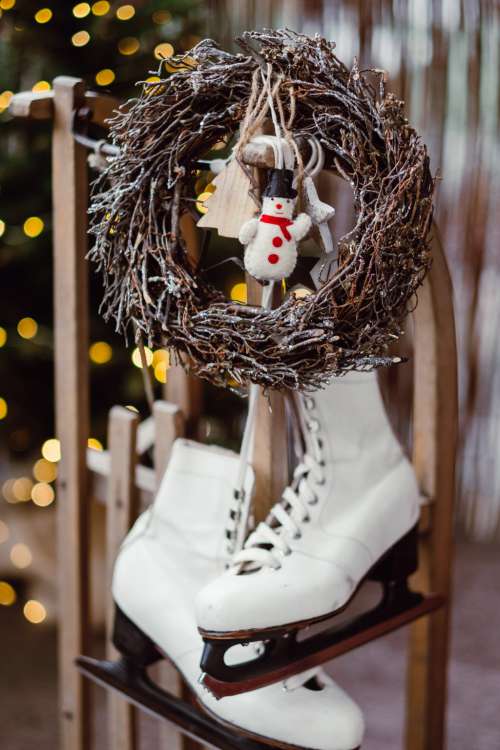 Christmas wreath and vintage ice skates on a wooden sled 6