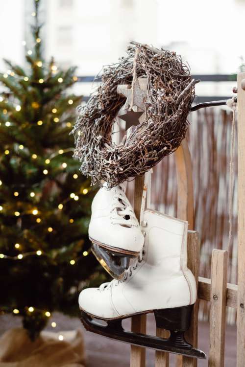 Christmas wreath and vintage ice skates on a wooden sled 3
