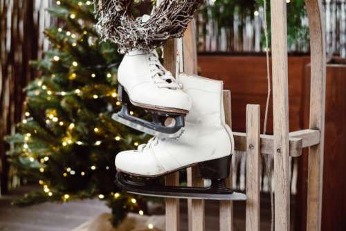 Christmas wreath and vintage ice skates on a wooden sled 4