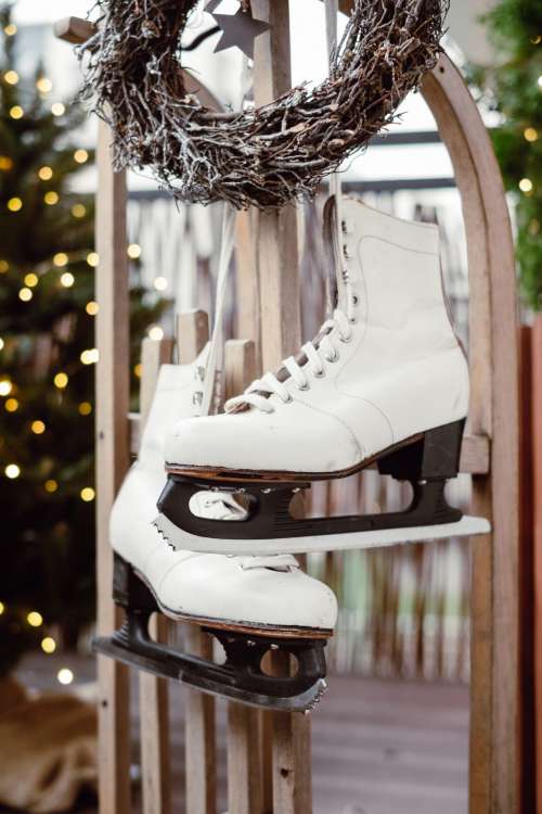 Christmas wreath and vintage ice skates on a wooden sled 5