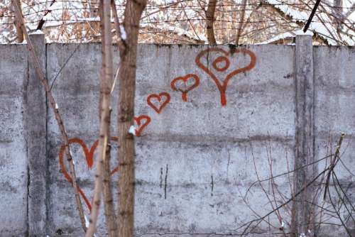Hearts graffiti on the wall on a winter afternoon