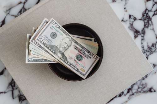 Dollar bills on a marble table