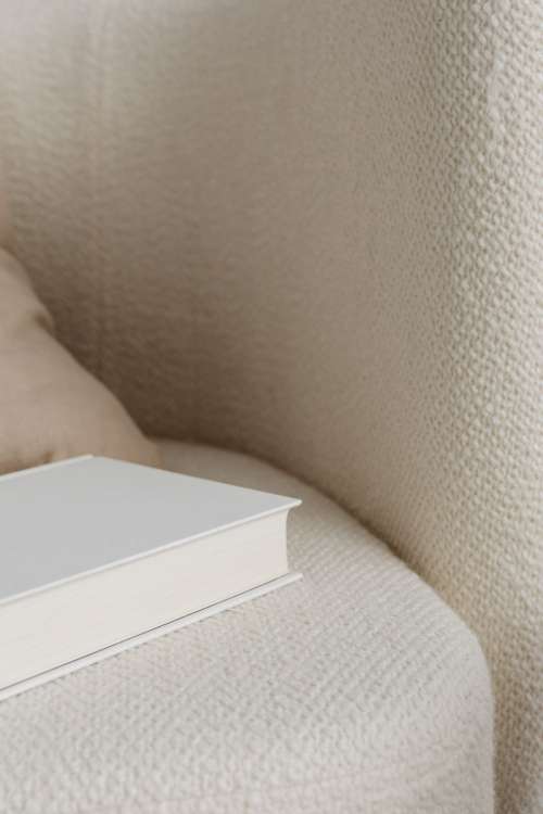 Free photos for mockups - blank cover book - cream armchair - linen pillow