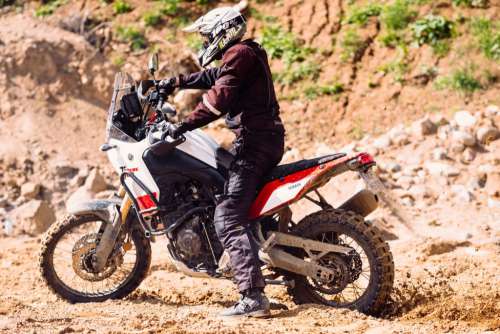 Motor biker at a sand quarry