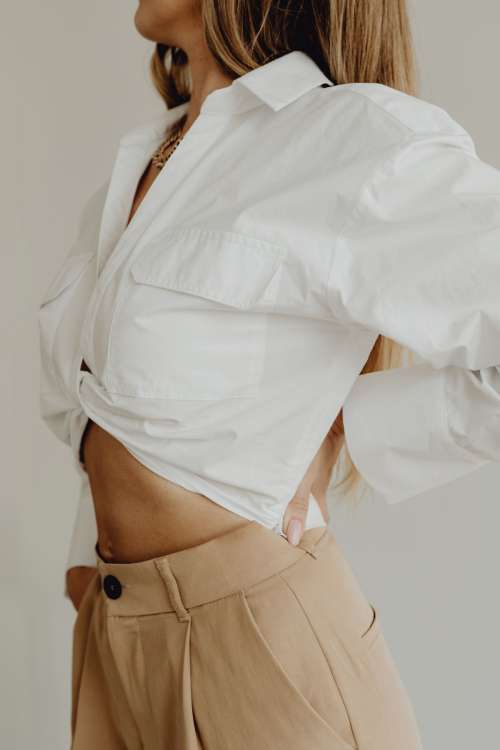 Minimal fashion - Unrecognizable Woman in beige trousers