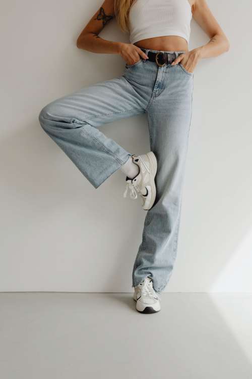Stylish woman in high waisted wide leg jeans