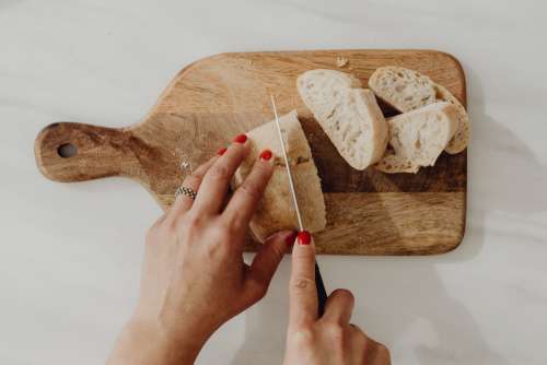 Woman making bruschetta with healthy ingredients