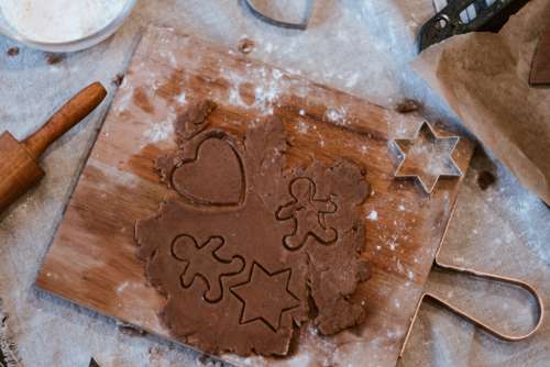 Cutting out gingerbread Christmas biscuits 13