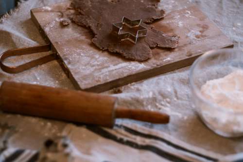 Cutting out gingerbread Christmas biscuits