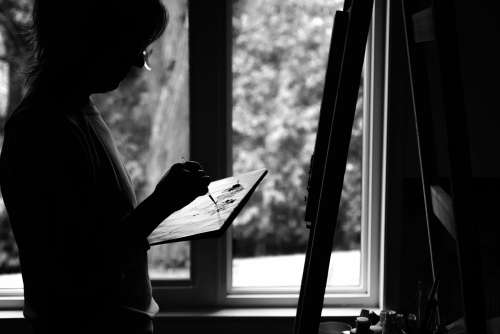 Monochrome Photo Of A Person Painting On An Easel Photo
