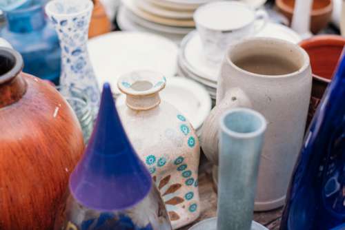 Old vintage ceramic pots and vases at a flea market
