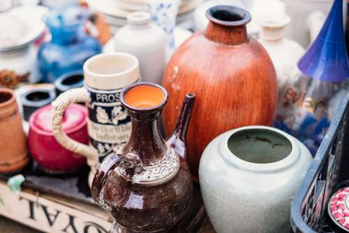 Old vintage ceramic pots and vases at a flea market 2